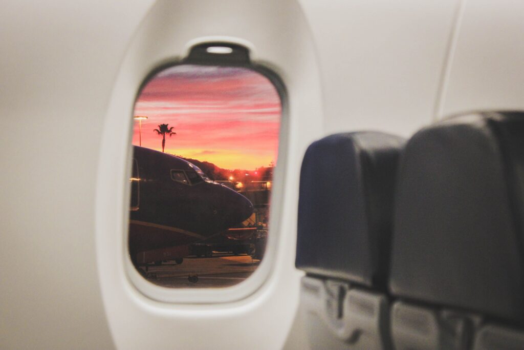 airplane window sunset flight