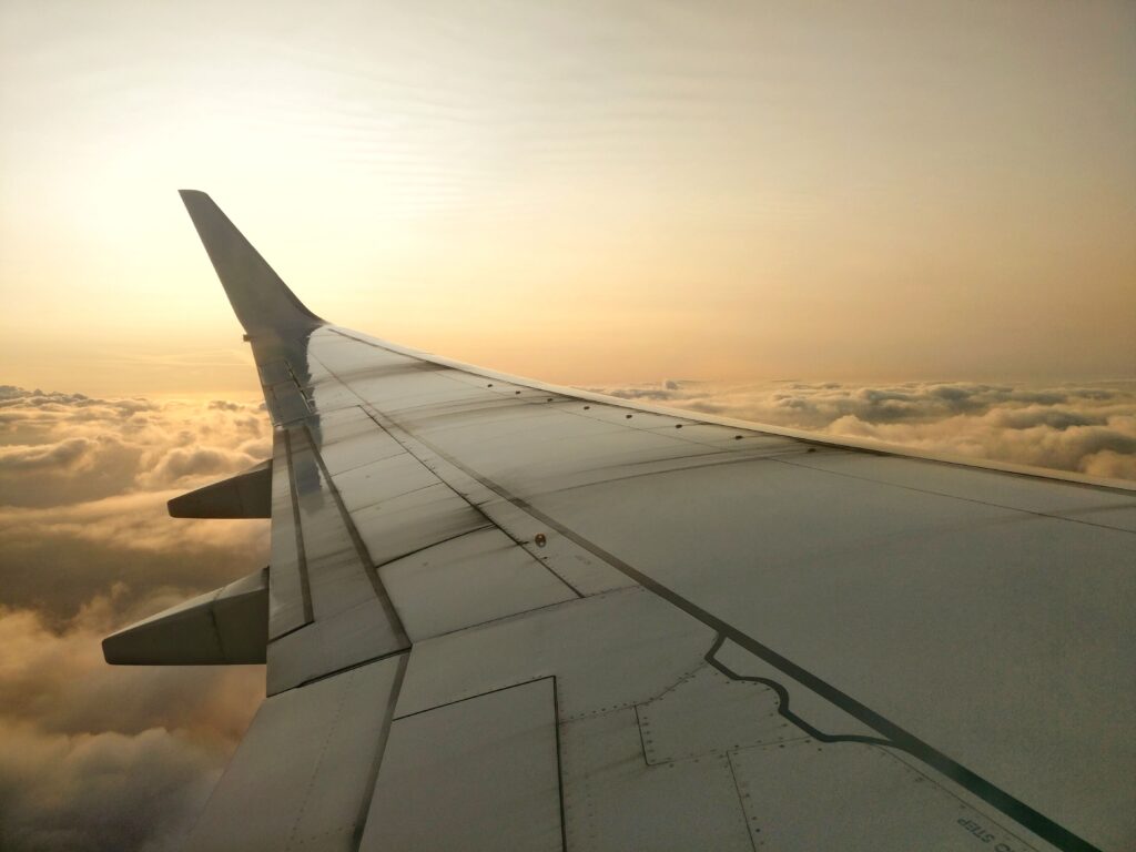 Airplane wing view during descent before landing
