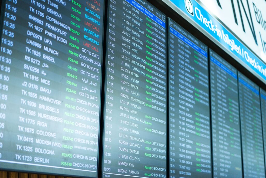 Airport departure board with multiple flight times