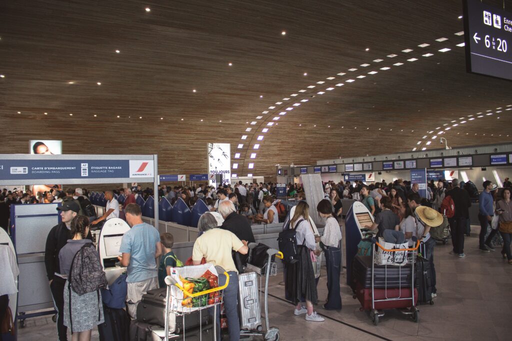 airline staff scanning boarding pass at departure gate 2026